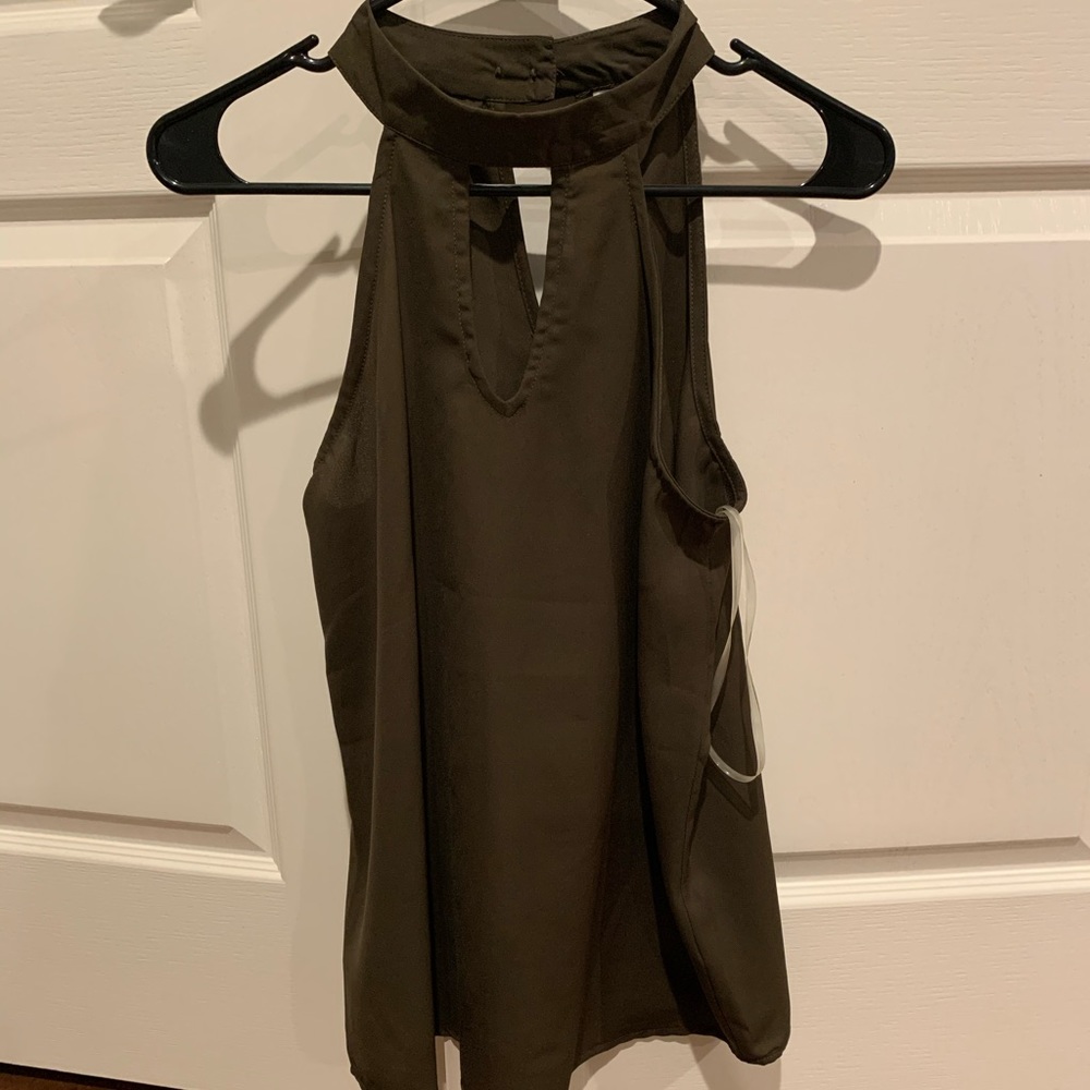 High neck flowy “swing” sleeveless dressy top!